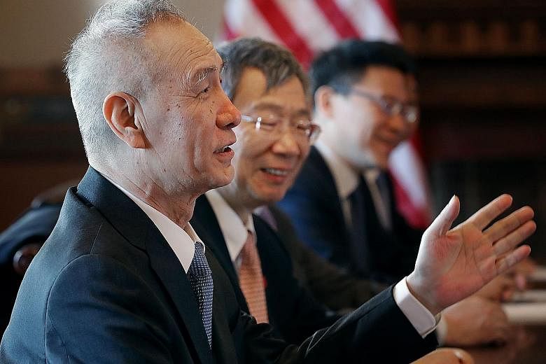 Chinese Vice-Premier Liu He (left), central bank governor Yi Gang (second from left) and members of a high-level trade delegation from China in discussions on Wednesday with US government ministers in Washington.
