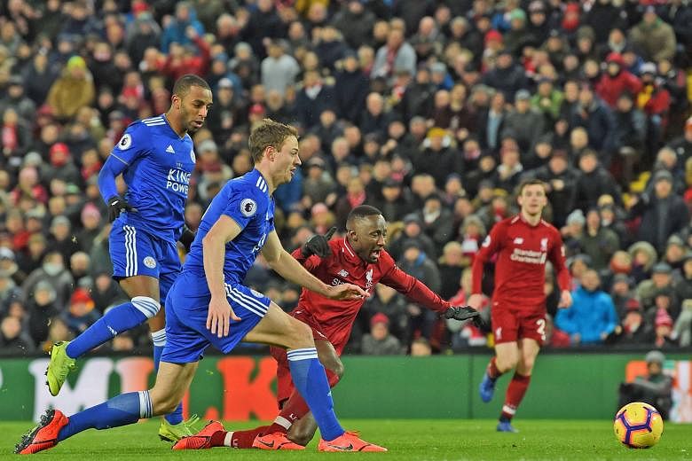 Liverpool's Guinean midfielder Naby Keita goes down in the area after a challenge from Leicester City's Ricardo Pereira (left) but referee Martin Atkinson refuses to give a penalty which frustrates Jurgen Klopp.