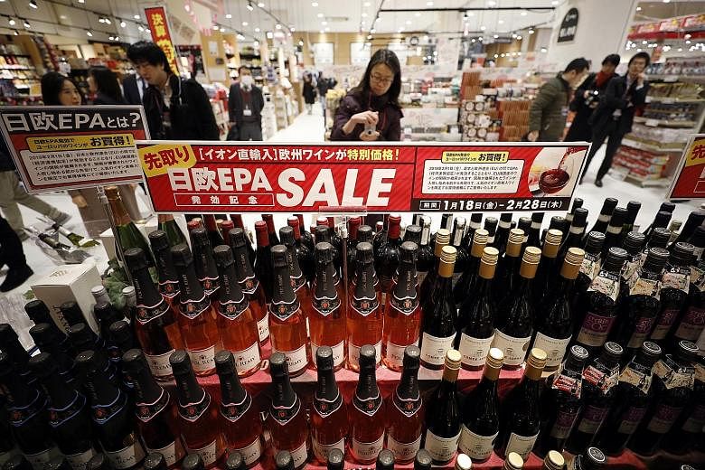 Supermarkets like this one in Chiba, near Tokyo, have already cut prices on imported wines from the European Union. With the trade deal, European consumers can enjoy cheaper Japanese products such as sake and beef.