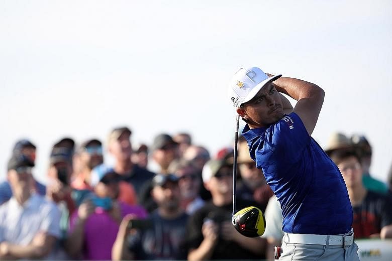 Rickie Fowler on his way to a six-under 65 for a 129 total at the Phoenix Open at Scottsdale, Arizona, on Friday. He is just one stroke ahead of Justin Thomas (66), also his housemate for this tournament.
