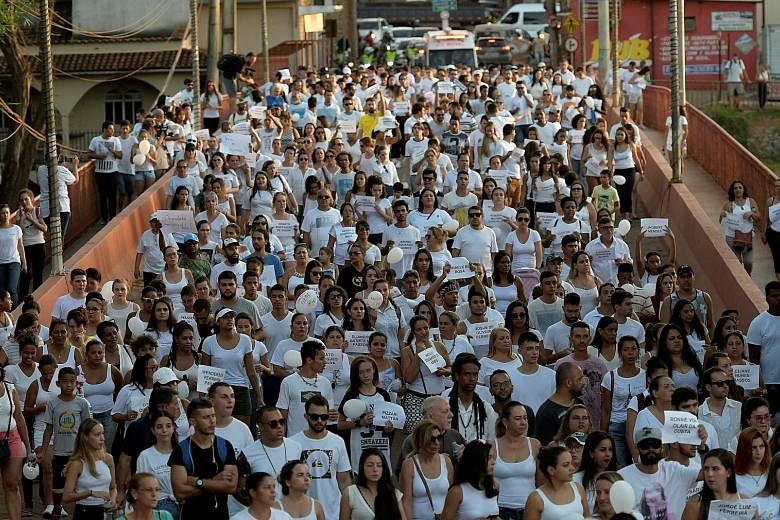 Residents of Brumadinho, Brazil, marching on Friday in memory of the victims of the collapsed dam owned by Brazilian mining company Vale. Some people say its top executives should be jailed.
