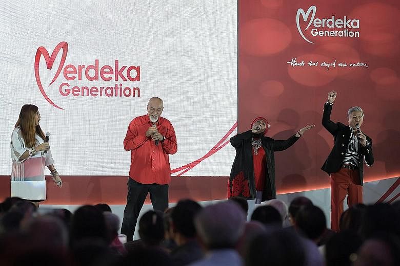 (From left) Local musicians Jacintha Abisheganaden, Mel Ferdinands, Rahimah Rahim and Dick Lee performing for their fellow Merdeka Generation members at a tribute event at Gardens by the Bay yesterday.
