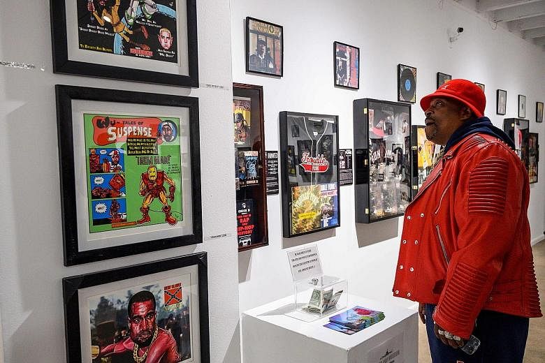 Grandmaster Caz looking at memorabilia at the Hip-Hop Museum Pop-Up Experience in Washington, DC. He wrote parts of Rapper's Delight, which is credited as the commercial start of hip-hop.