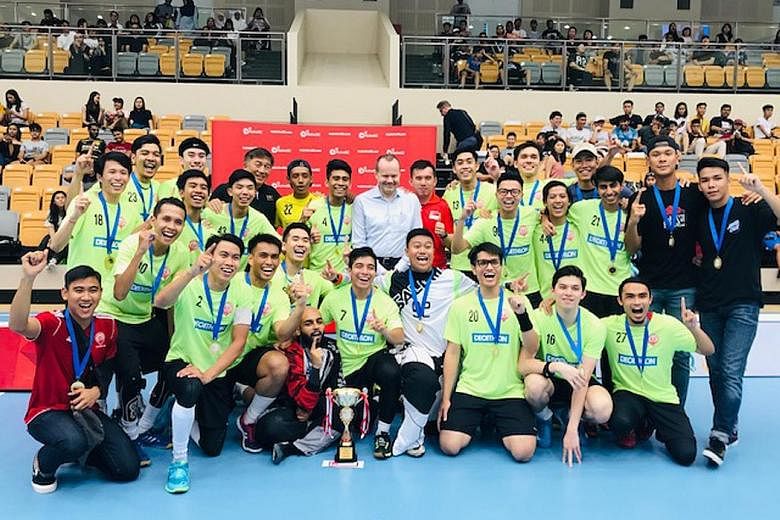 Tomas Eriksson, president of the International Floorball Federation, posing with victorious Victoria School players at Our Tampines Hub yesterday. The ActiveSG-Singapore Floorball Association (SFA) Men's Premier League closed on a high note as close 