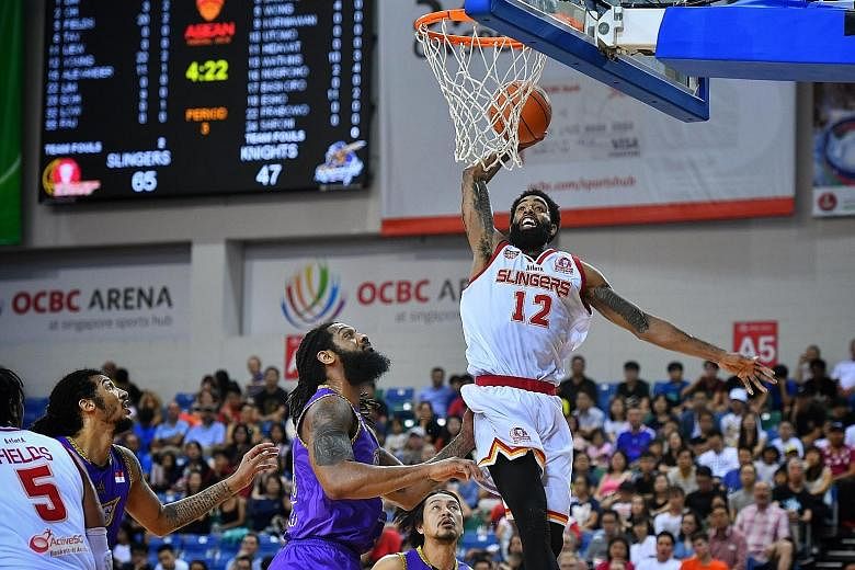 Singapore Slingers' Jerran Young dunking two of his ABL career-high 36 points yesterday. He also had 14 rebounds and seven assists as the Slingers beat the CLS Knights Indonesia 95-76 at the OCBC Arena.