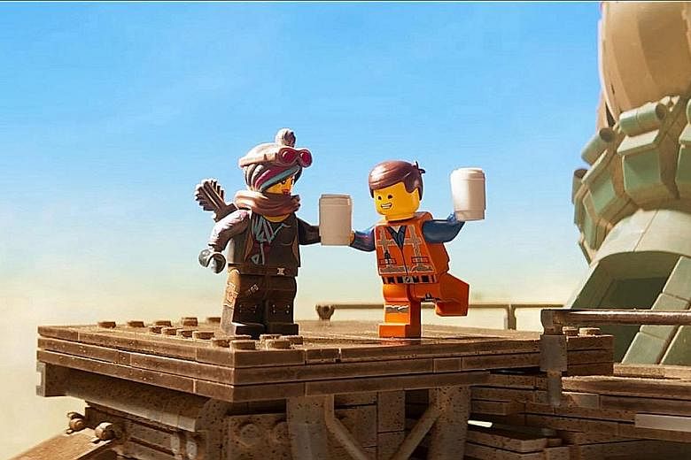 Actor Chris Pratt (above with co-star Tiffany Haddish) reprises his role as Emmet in The Lego Movie 2 (top).