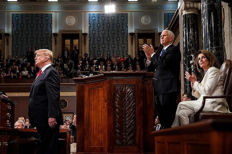 United States President Donald Trump delivering the State of the Union address at the US Capitol in Washington on Tuesday. With him are Vice-President Mike Pence and Speaker of the House Nancy Pelosi.