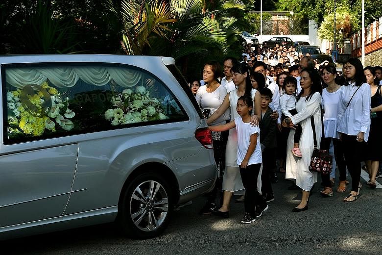 Mr Ben Goi's hearse leaving for Mandai Crematorium yesterday. His father, Mr Sam Goi, said in his eulogy at Mandai: "I hope my youngest son can have a happy life in heaven as he did in life. I must thank everyone for coming to my place and sending hi