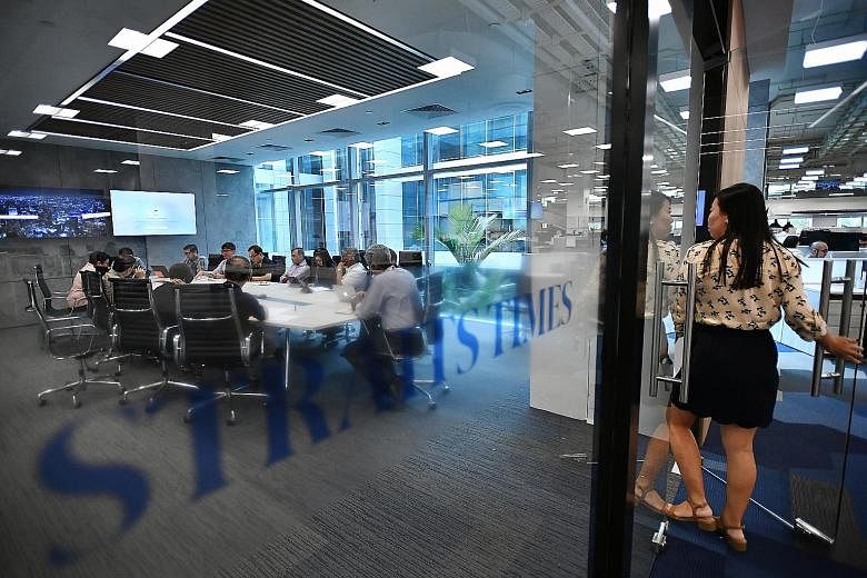 ST's revamped newsroom will allow staff from different desks to collaborate and work more seamlessly across platforms, with numerous discussion corners and nine "phone booths" (below, right), where staff can make calls or work on stories together. Th