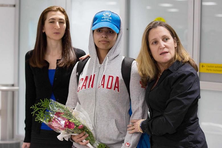 Saudi teenager Rahaf Mohammed Alqunun being welcomed by Canadian Foreign Minister Chrystia Freeland (right) when she arrived at the Pearson International airport in Toronto last month. The teenager fled to Bangkok last month and warned that she would