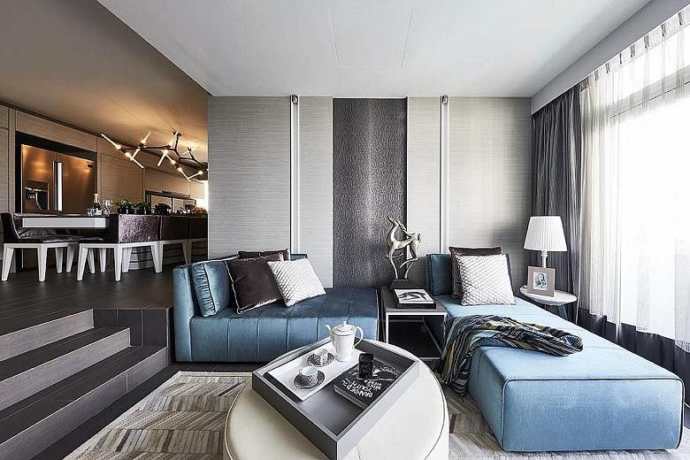 In this bedroom, most of the wall space has been turned into stylishly concealed storage. The guest room's built-in storage is wrapped around the daybed, which is the space's centrepiece and is enhanced by the feature wall. The bathtub that was previ