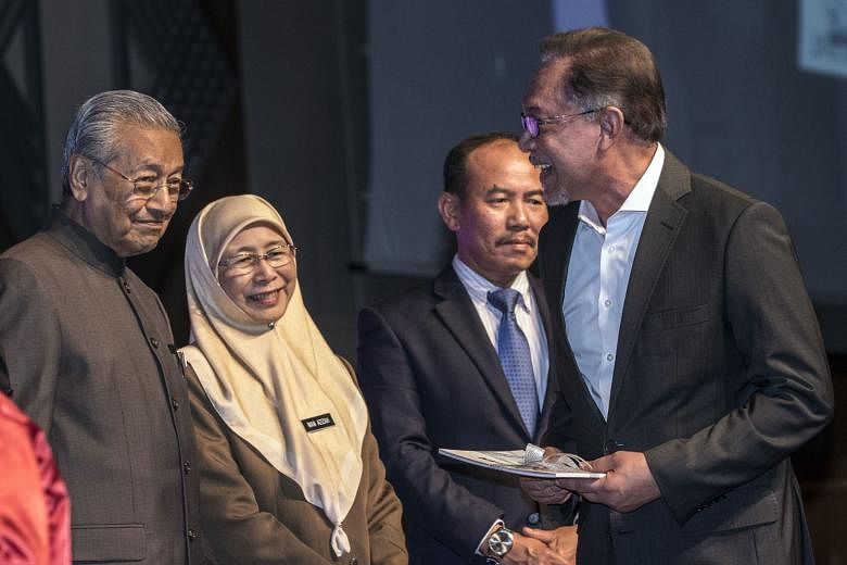 (From left) Malaysian Prime Minister Mahathir Mohamad, Deputy Prime Minister Wan Azizah Wan Ismail, Chief Secretary Ismail Bakar and prime minister-in-waiting Anwar Ibrahim at the launch of the National Anti-Corruption Plan in Putrajaya on Jan 29.