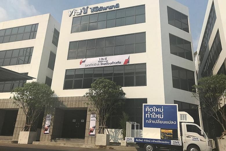 Left: The quiet headquarters of the Thai Raksa Chart Party in Bangkok yesterday. Its afternoon campaign in Bangkok was called off, and rumours have swirled about the fate of its executive committee.
