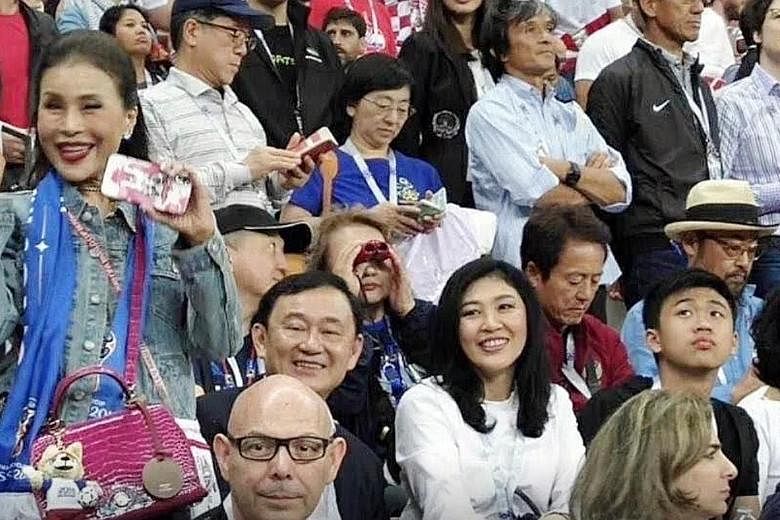 Former princess Ubolratana Rajakanya (left, standing) at a World Cup match in Russia last year with Thaksin Shinawatra and his sister Yingluck, both of whom are former prime ministers of Thailand who fled the country to avoid jail terms. Ms Ubolratan