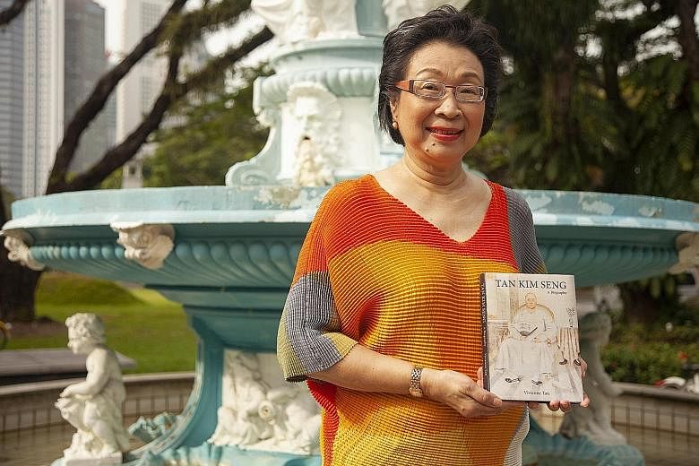 Above: First-time author Vivienne Tan at the Tan Kim Seng Fountain with her book on her husband's ancestor.