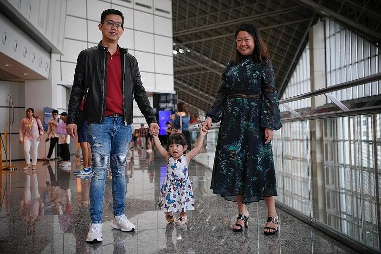 Ms Lin Xiu Zhen and her husband Ivan Yeo with their daughter Zara, two, whom they adopted from Malaysia when she was one month old. About 30 per cent of the adoption applications in the past five years involved Singaporean children - the rest were mo