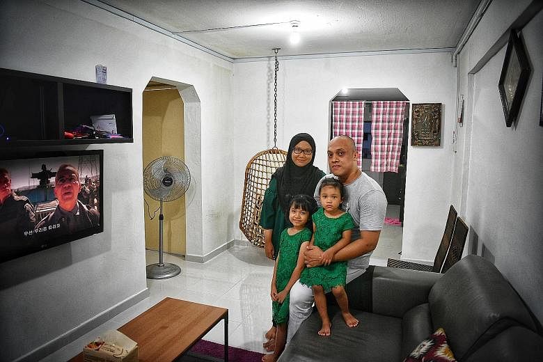 Mr Mohammad Suhaimi Junaini, his wife Mariamah Tukiran, daughters Dhiya Marissa and Zia Syadza (on sofa) moved into their new three-room flat in September.