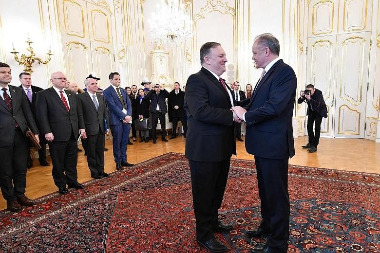 US Secretary of State Mike Pompeo (left) being greeted by Slovakia's President Andrej Kiska in Bratislava yesterday, during his week-long tour across central Europe.