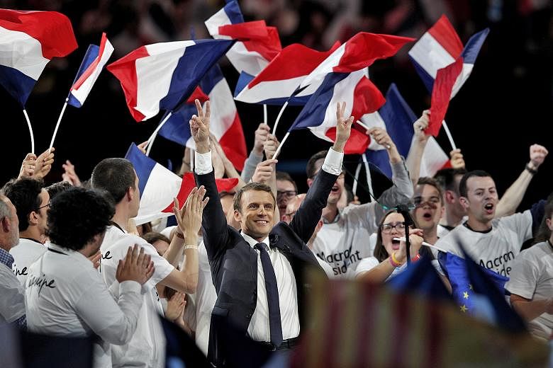 Then presidential candidate Emmanuel Macron at a campaign rally in Paris during the 2017 French presidential election. Foreign actors leaked hacked data from Mr Macron's campaign just two days before the second round of voting.