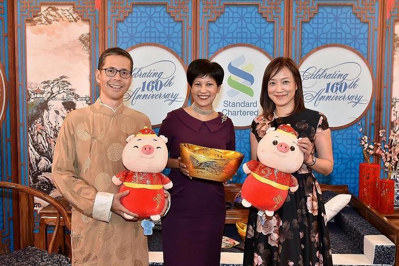 It's double happiness for Standard Chartered as the bank ushered in the Year of the Pig and marked its 160th anniversary in Singapore yesterday. At the event was guest of honour Indranee Rajah (centre), Minister in Prime Minister's Office and Second 