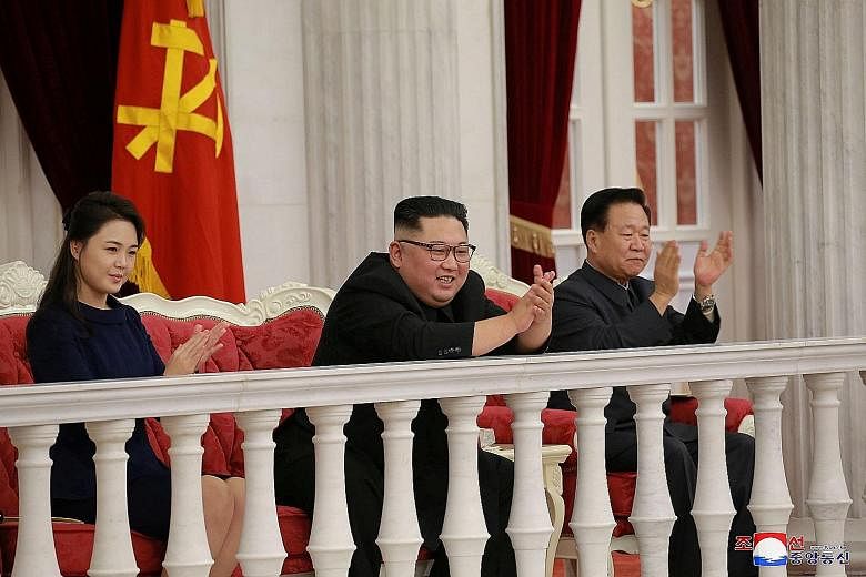 North Korean leader Kim Jong Un (centre) and his wife, Ms Ri Sol Ju, watching a performance in Pyongyang last week. He is due to meet US President Donald Trump for a second summit, in Hanoi, in a fortnight.