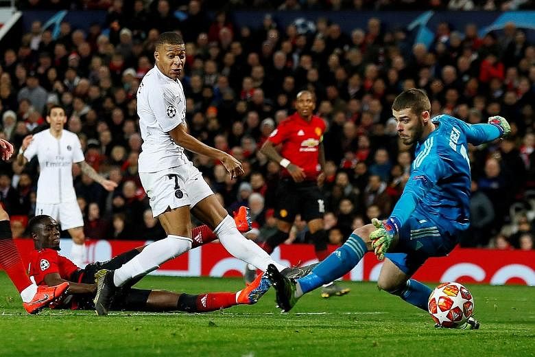 PSG forward Kylian Mbappe slotting past Manchester United custodian David de Gea for his team's second goal in the Champions League last-16, first-leg tie at Old Trafford on Tuesday.