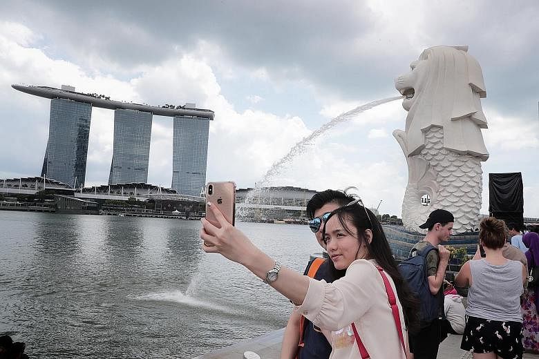 Married couple Tan Gui Ping and Lin Ming from Fujian, China, are visiting Singapore for the first time. China is the biggest source of tourists to Singapore, accounting for 3.4 million visitors who spent $3.16 billion between January and September la
