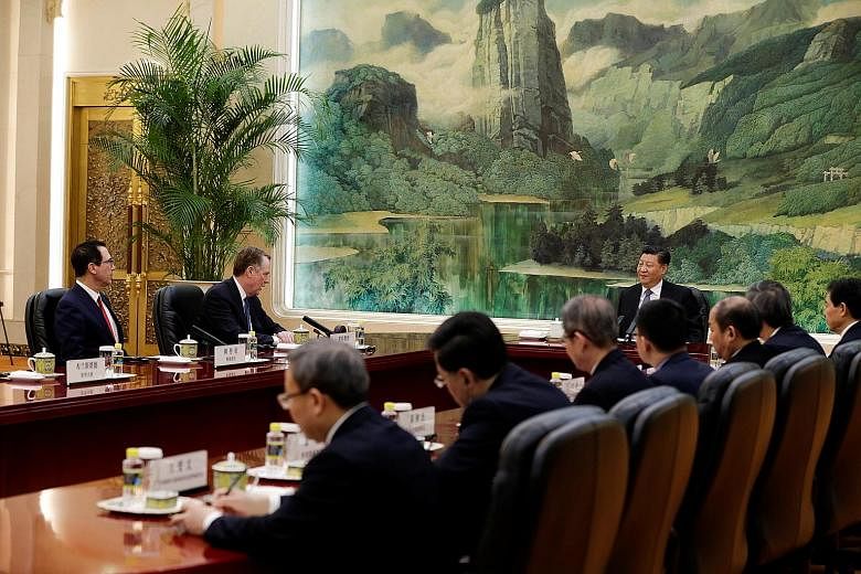 From left: United States Treasury Secretary Steven Mnuchin and Trade Representative Robert Lighthizer at a meeting with Chinese President Xi Jinping and Chinese officials at the Great Hall of the People in Beijing yesterday. Both Mr Xi and Mr Lighthi