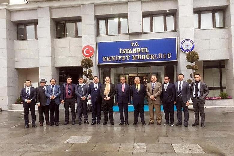 Malaysian police chief Mohamad Fuzi Harun (sixth from right) and senior officers in front of the Istanbul police headquarters.