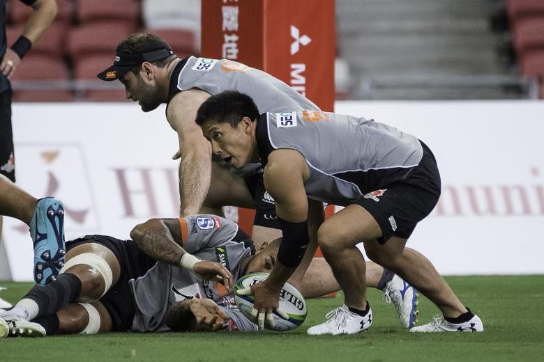 The Sunwolves players getting a feel of the National Stadium pitch yesterday. They will face the Sharks today in their opening game of the 2019 Super Rugby season.