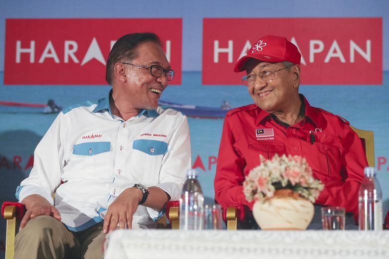 Malaysia's prime-minister-in-waiting Anwar Ibrahim with Prime Minister Mahathir Mohamad during a political event last year. The two men head separate parties in the ruling coalition.