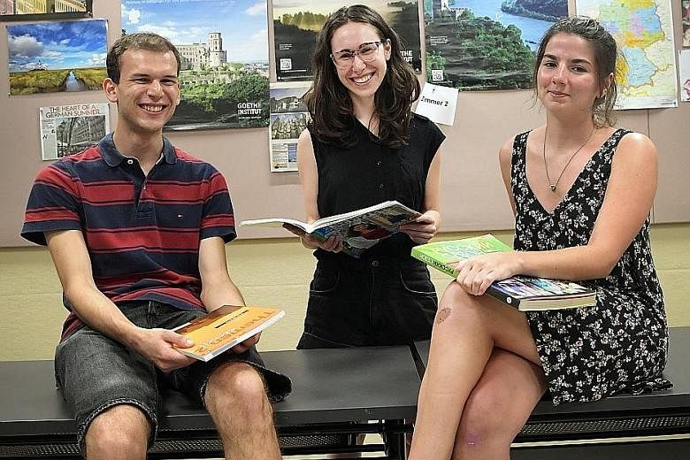 Czech Republic exchange students Martin Kucera and Martina Voskova (centre), 26, take German classes at NTU's Centre for Modern Languages, while Ms Fionnuala Joseph from Britain studies Russian.