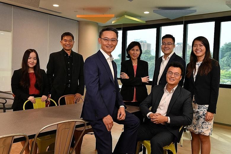 The MTI officials involved in bringing the FTA to fruition include (back row, from left) assistant director Gerbera Choo, deputy secretary (Trade) Luke Goh, director-general (Trade) Ng Bee Kim, director Chua Shun Loong and assistant director Judith H