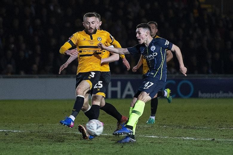 Phil Foden scoring Manchester City's third (and his second) goal during Saturday's FA Cup fifth-round tie with Newport County. City won 4-1 to reach the quarter-finals.
