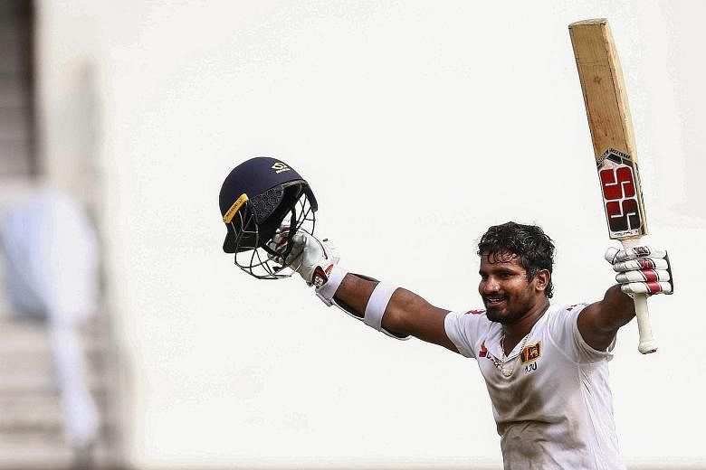 Sri Lanka's Kusal Perera raises his arms in celebration after his winning hit against hosts South Africa in their first Test.
