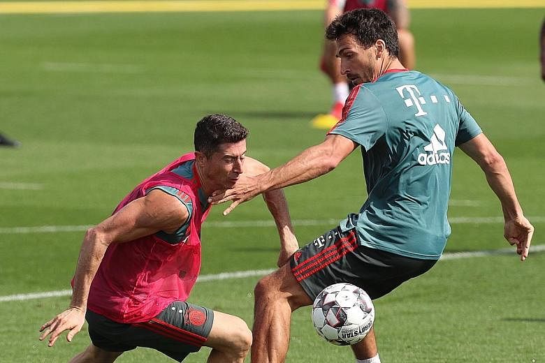 Robert Lewandowski (left) and Mats Hummels, who both joined Bayern Munich from Borussia Dortmund, training during their winter camp in Doha last month. Liverpool boss Jurgen Klopp used to manage Dortmund but says he has gotten over his fierce rivalry