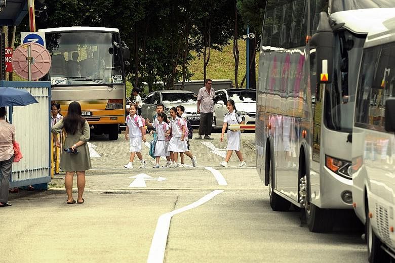 Pei Hwa Presbyterian Primary School pupils on their way to school. Singaporean primary and secondary school students will receive a $150 top-up to their Edusave accounts this year, in addition to the yearly contributions.