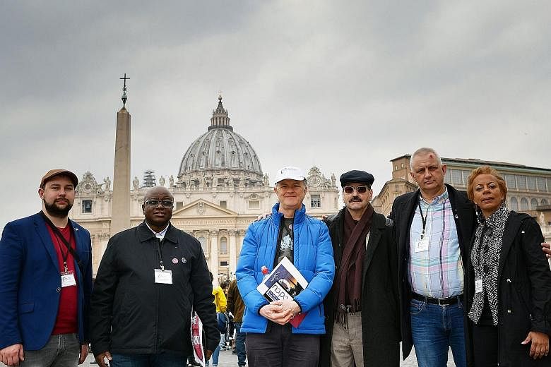 Church sexual abuse survivors (from left in photo) Maniuse Mileiosky, Benjamin Kitobo, Peter Saunders, Jacques, Marek Lisinski and Denise Buchanan in front of St Peter's Square in Vatican City on Monday.