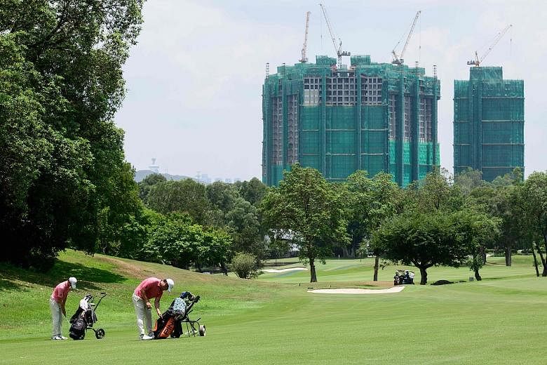 Golfers at Hong Kong's exclusive Fanling golf course tee off to views of construction as lawmakers seek to increase housing supply in the densely populated city. The government will take back 32ha of land, nearly a fifth, from the golf course as earl