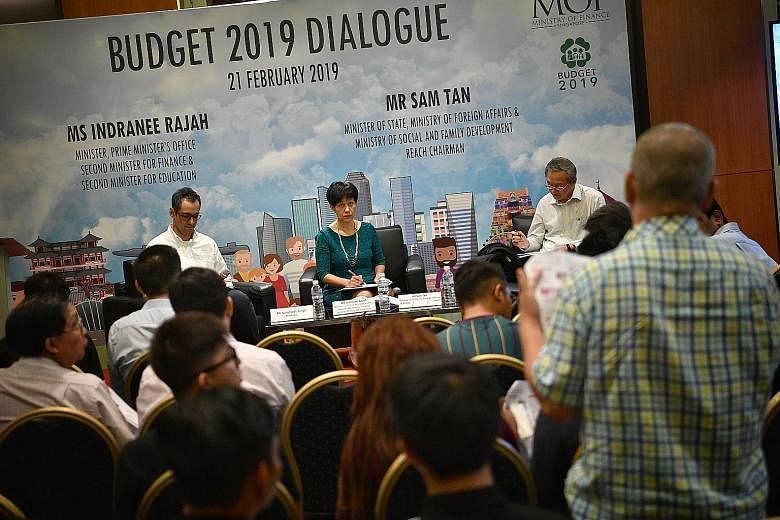 Second Minister for Finance and Education Indranee Rajah (centre) and Minister of State for Foreign Affairs, and Social and Family Development Sam Tan (right), who is also Reach chairman, fielding questions from attendees at a feedback session on the