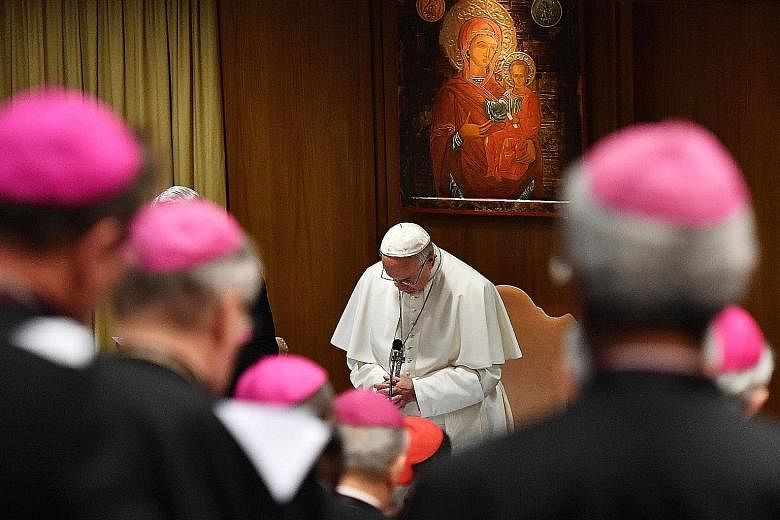 Pope Francis praying yesterday during the opening of a global child protection summit, on the sex abuse crisis within the Catholic Church, at the Vatican. Three themes - responsibility, accountability and transparency - form the backbone of the summi