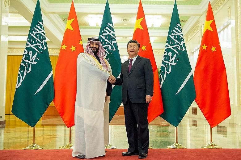 Saudi Crown Prince Mohammed bin Salman, who is on an Asia tour, with Chinese President Xi Jinping during their meeting at the Great Hall of the People in Beijing yesterday.