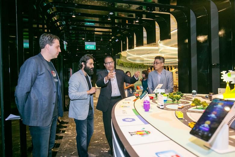 From left: Google Cloud Asia-Pacific managing director Rick Harshman and Google's programme manager for developer ecosystem, South-east Asia, Sami Kizilbash with Communications and Information Minister S. Iswaran on a tour of Developer Space @ Google