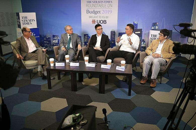 Panellists at last week's Straits Times-UOB Budget Roundtable were (from left) moderator Vikram Khanna, ST associate editor; Mr Ho Meng Kit, CEO of Singapore Business Federation; Mr Barnabas Gan, economist, UOB; Mr Patrick Tay, labour MP and NTUC ass