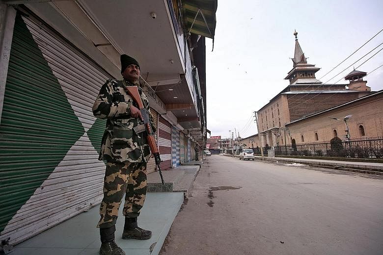An officer from the Indian Central Reserve Police Force on guard in Srinagar, Kashmir, yesterday. India and Pakistan both claim Kashmir in entirety but control different parts of the state. The two nuclear-armed countries have gone to war thrice over