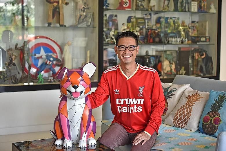 Mr Tan in his living room, his favourite part of the apartment, where he spends lots of time with his wife and daughter chit-chatting, playing board games or watching TV. It is where he also has a huge collection of rare figurines, toys and collectib