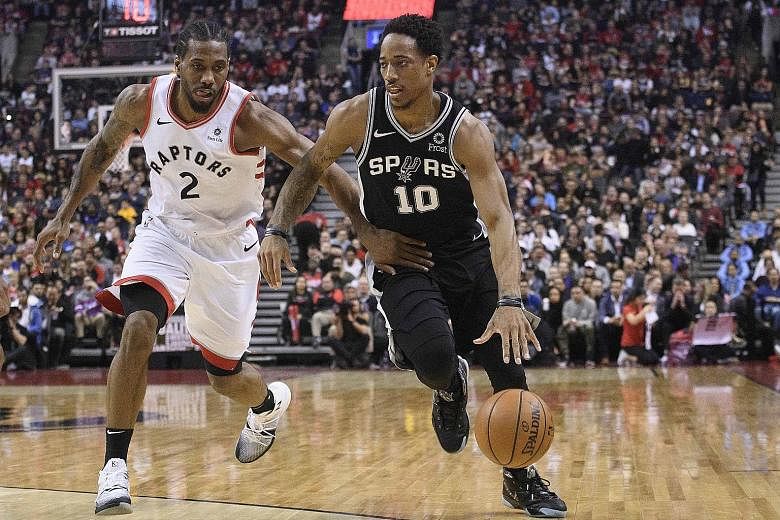 San Antonio Spurs guard DeMar DeRozan (right) shielding the ball from Toronto Raptors forward Kawhi Leonard during their National Basketball Association match at the Scotiabank Arena on Friday. Leonard scored the final four points in the Raptors' 120