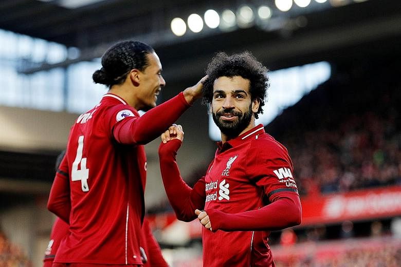Leading striker Mohamed Salah (right) and dependable defender Virgil van Dijk will be the key men who can end Liverpool's league title drought this season.