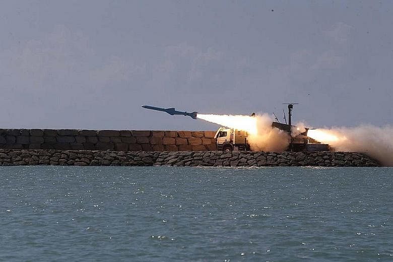 The ground-to-ship short-range cruise missile Ghader is seen in an Iranian Navy Office photo being test-fired in the Sea of Oman on Saturday.