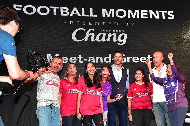 From left: Liverpool fans James Linus, Isabelle Linus, Gabrielle Joseph, Anabelle Linus, former Liverpool goalkeeper David James, Udabelle Linus, ex-Manchester United defender Mikael Silvestre and Vanessa Tifanny pose for a group shot. They were amon